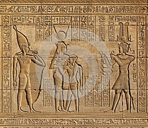 Hieroglyphic carvings in ancient egyptian temple