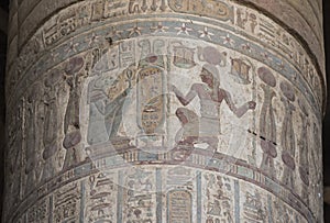 Hieroglyphic carvings on an ancient egyptian temple column