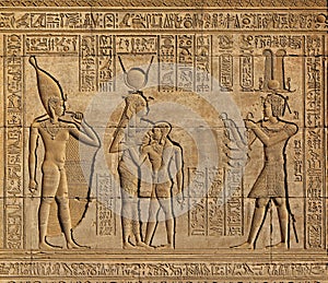 Hieroglyphic carvings in ancient egyptian temple photo