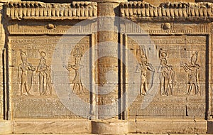 Hieroglyphic carvings in ancient egyptian temple