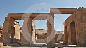 Hieroglyphic carvings and columns at an ancient egyptian temple