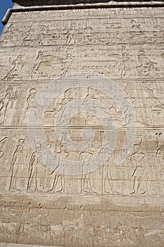 Hieroglyphic carvings on an egyptian temple wall