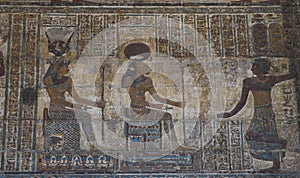 Hieroglypic carvings on wall in ancient egyptian temple