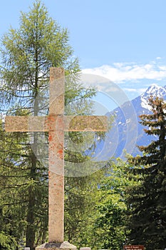 Cross at the churchyard of St FerrÃÂ©ol d`Huez church, France photo