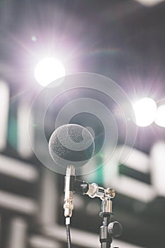 High accuracy microphone in noise sound testing room with LED light bokeh. High technology. Microphone for noise recorder.