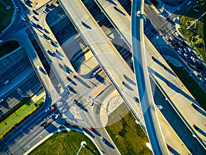 High Aerial Drone view over overpassing interchanges and interstates and highways and roads