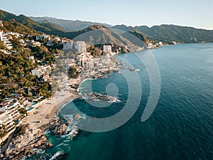 High aerial view of Conchas Chinas Beach and it nearby hotels in Puerto Vallarta Mexico photo