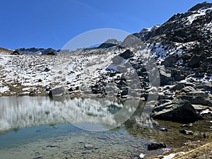 High alpine lakes next to the mountain hut (Chamanna da Grialetsch CAS or Grialetsch-Hutte SAC) in the Albula Alps photo
