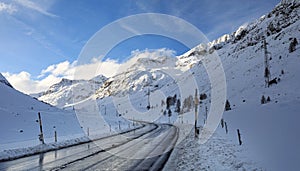 High alpine road Via da Gueglia in winter. Switzerland