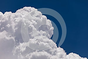 High Altitude Cumulonimbus Clouds with Clear Blue Sky Background