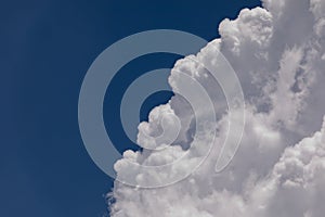 High Altitude Cumulonimbus Clouds with Clear Blue Sky Background