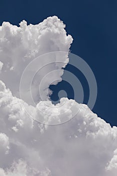 High Altitude Cumulonimbus Clouds with Clear Blue Sky Background