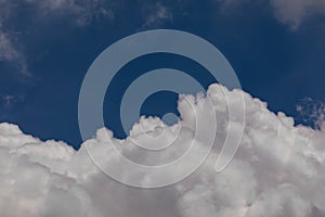 High Altitude Cumulonimbus Clouds with Clear Blue Sky Background