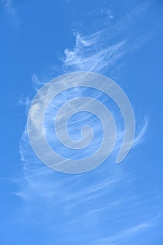 High altitude cumulus clouds on blue sky