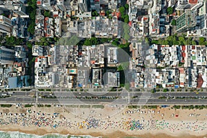 High altitude, drone shot of the city and a shoreline along the beach