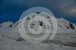 High altitude mountain range snow-capped glacier peak