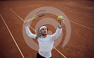 High angel view on man tennis player serving ball