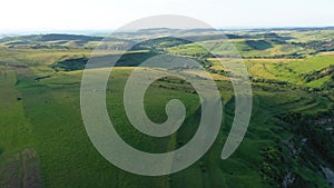 High Angle Aerial Above View of Green Meadow in the Spring, Countryside Hills