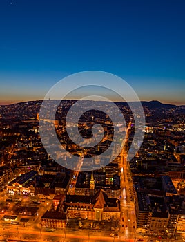 High angle Aerial drone shot of St. Francis parish church by Danube in Budapest twilight