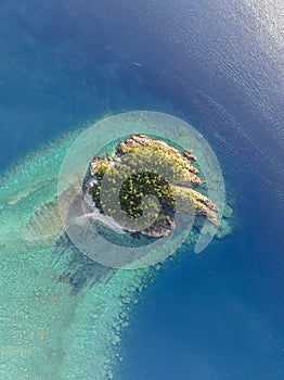 High angle aerial drone view of Arkhurst Island, a small islet next to Hayman Island