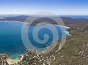 High angle aerial drone view of Coles Bay near Freycinet National Park, Tasmania, Australia.