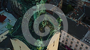 High angle aerial shot of authentic Latin Cathedral spire covered in patina in Lviv, Ukraine, old European town heritage