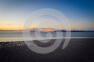 High Angle Beach at Lake With Sunset in the Background