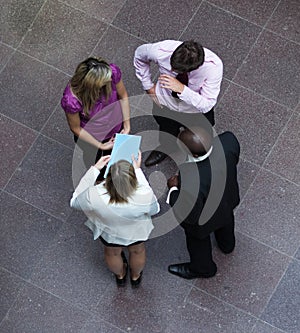 High angle of business people talking in office