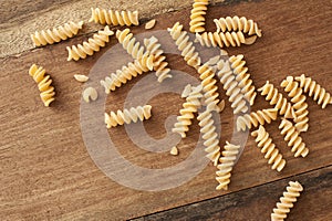 High-angle close-up view of raw fusilli pasta photo