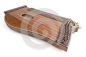 High angle closeup horizontal studio shot of vintage, old wooden zither isolated on white background. Detail of zither