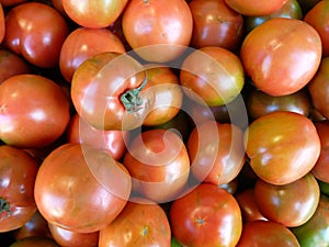 High angle closeup shot of half-ripe tomatoes