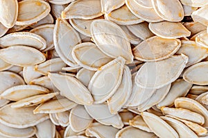 High angle closeup shot of a pile of pumpkin seeds captured at daylight