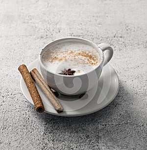 high angle coffee cup with cinnamon sticks star anise. High quality photo