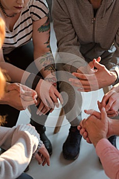 High angle on difficult young people during meeting of support g