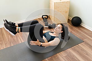 High angle of a fit woman working out at home