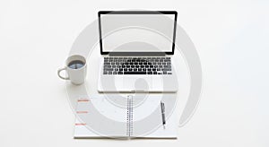 Modern Workspace with Laptop, Planner, and Coffee
