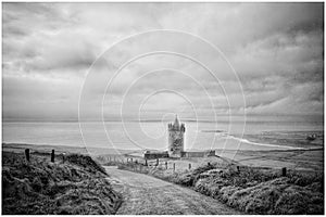 High angle greyscale shot of Doonagore Castle near Doolin in Co Clare,  Ireland