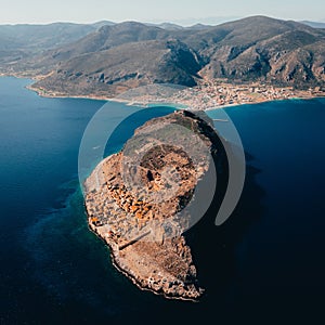 High angle of the island village buildings with the blue sea below in Monemvasia, Lakonia, Greece