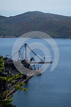 High angle of a lake and a crane for cargo ships in landscape in Croatia, Bakar