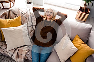 High angle photo of beautiful grandmother take nap in glasses sleeping on divan relaxing daydreaming isolated indoors