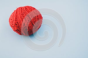 High angle shot of a ball of red yarn