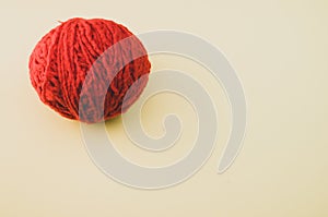 High angle shot of a ball of red yarn