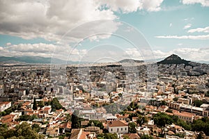 High angle shot of the beautiful city Athenes in Greece under the bright cloudy sky