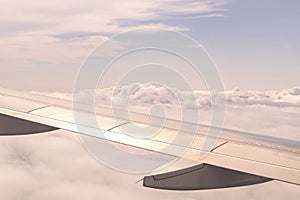 High angle shot of the beautiful fluffy clouds in the sky captured from an airplane