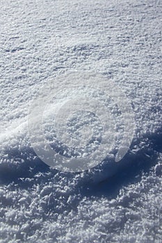 High angle shot of beautiful glowing snow textures - pureness concept