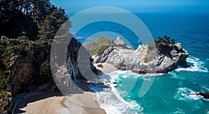 High-angle shot of cliffs and Mcway falls in Big Sur, California