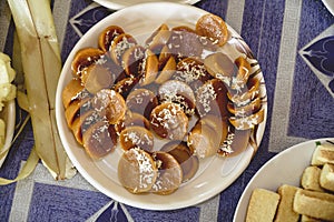 High angle shot of delicious Filipino Kutsinta treats in a white plate