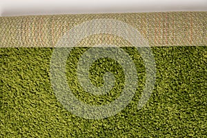 High angle shot of a green grass carpet roll