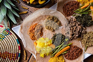 High angle shot of the ingredients of traditional Ethiopian food on loaves of bread