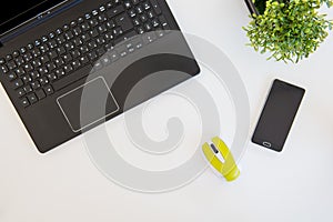 High angle shot of items on a table at an office workstation